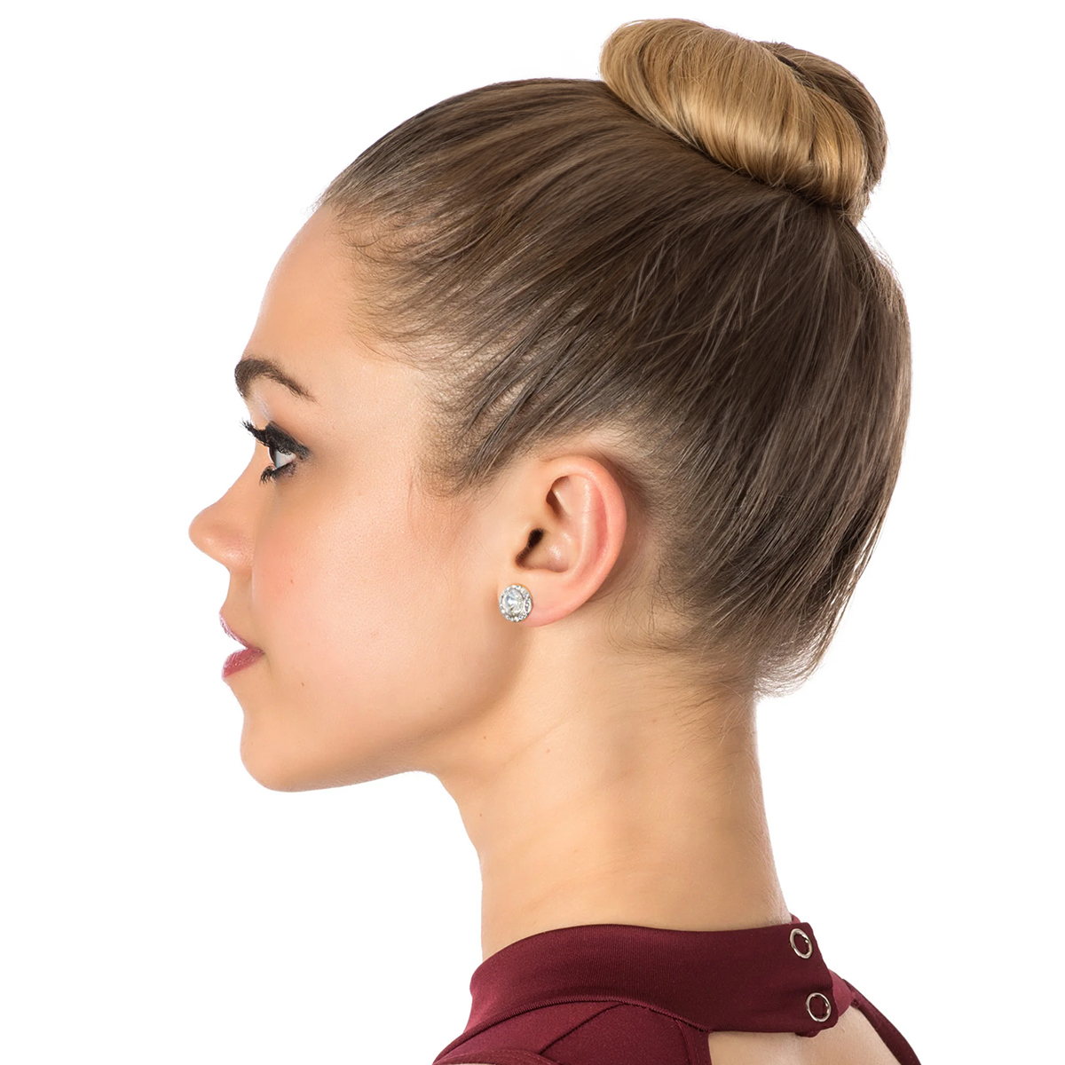 dancer in profile wearing celestial button earrings