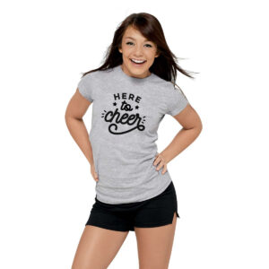 smiling model posing in a grey shirt that reads "Here to Cheer", front three-quarters view